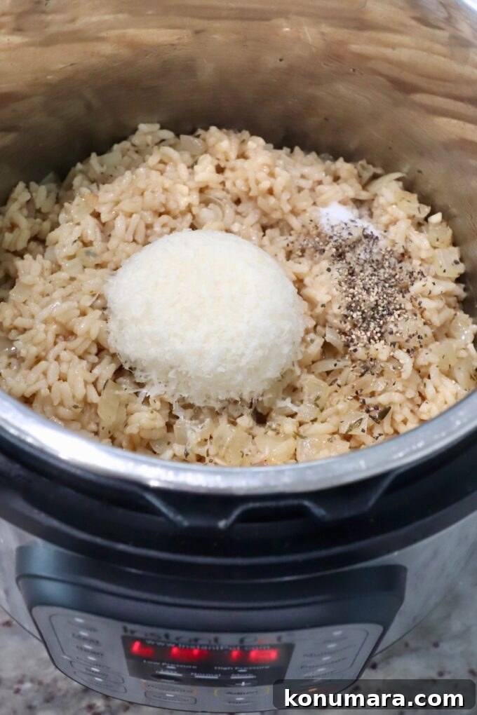 Creamy Instant Pot Risotto Recipe 8 cooked risotto in Instant Pot with parmesan cheese and seasonings