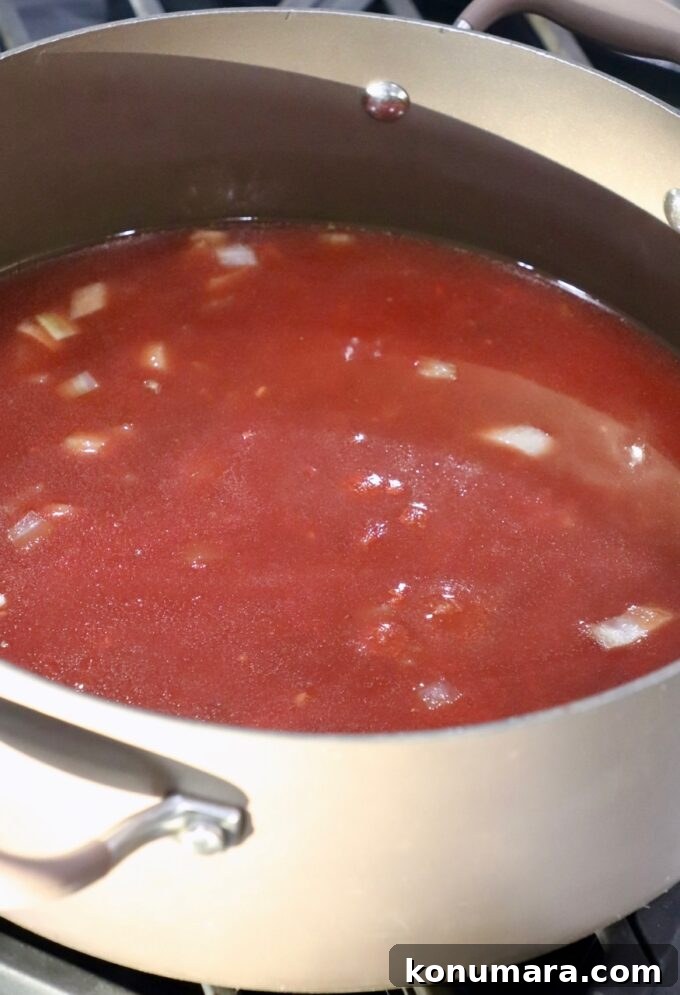 Classic Homemade Meatball Soup Recipe 4 tomato sauce in large pot on the stove