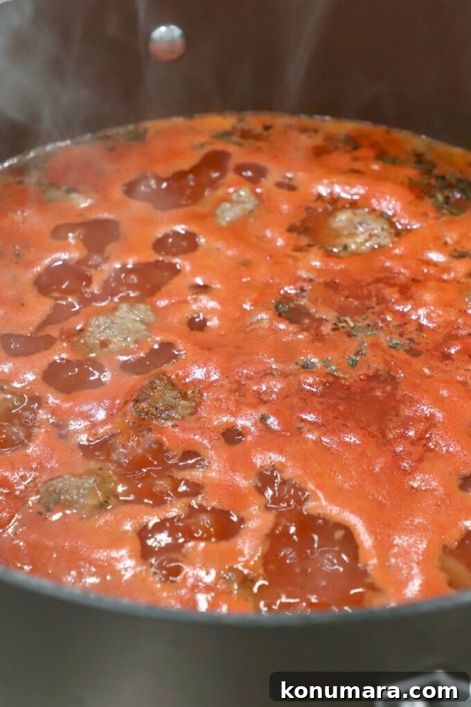 Classic Homemade Meatball Soup Recipe 6 soup simmering in pot