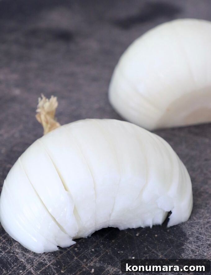 Caramelizing Onions: Step-by-Step Guide 4 onion sliced on cutting board
