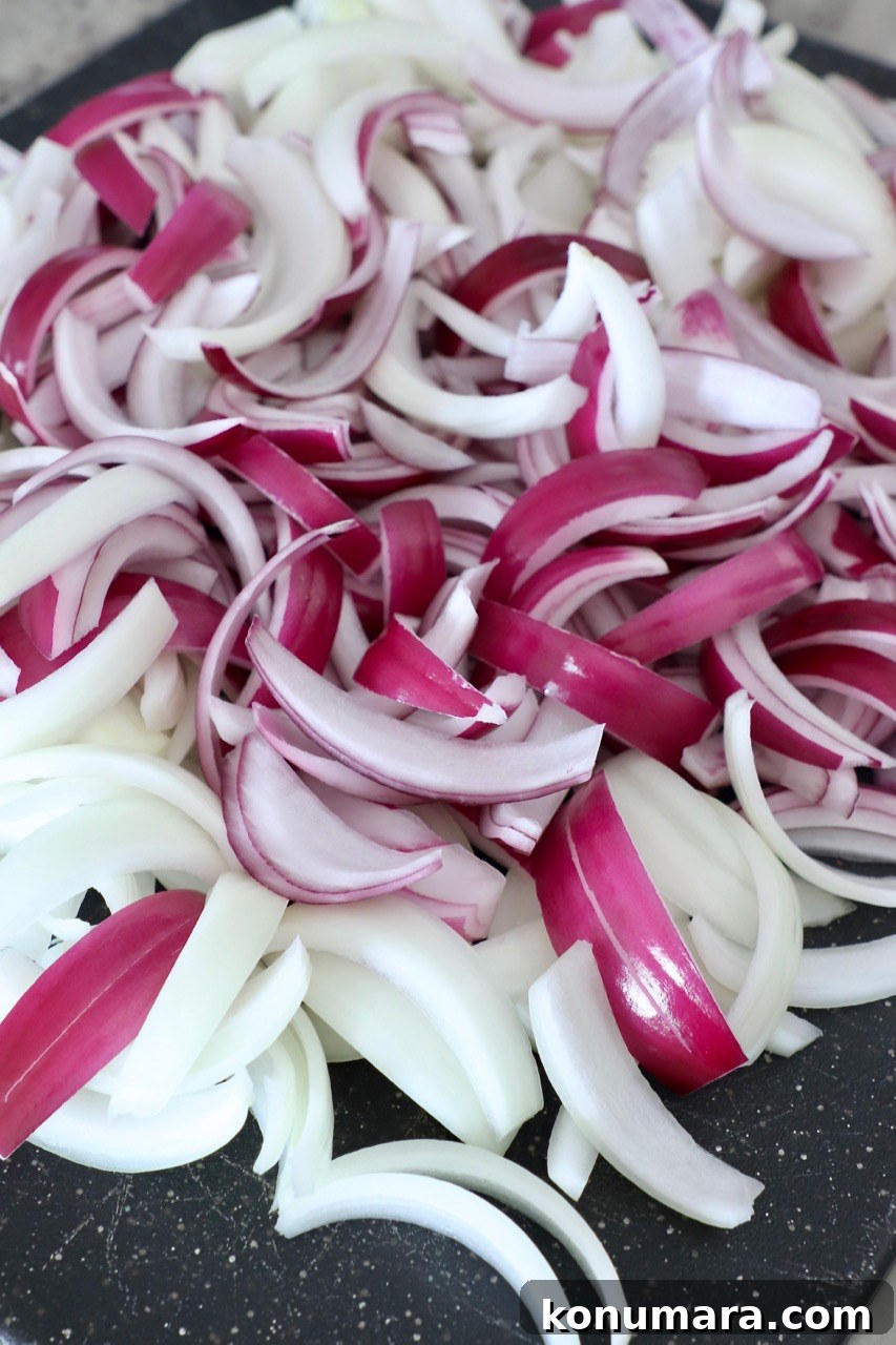 Caramelizing Onions: Step-by-Step Guide 7 sliced onion on cutting board