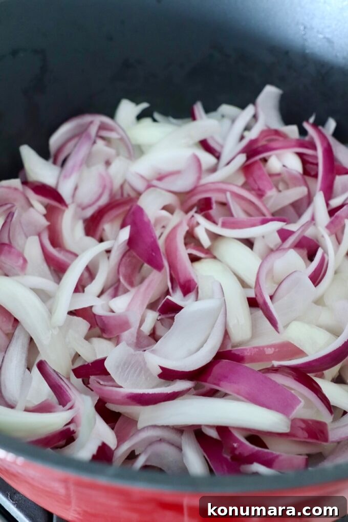 Caramelizing Onions: Step-by-Step Guide 9 sliced onions in pot on stove