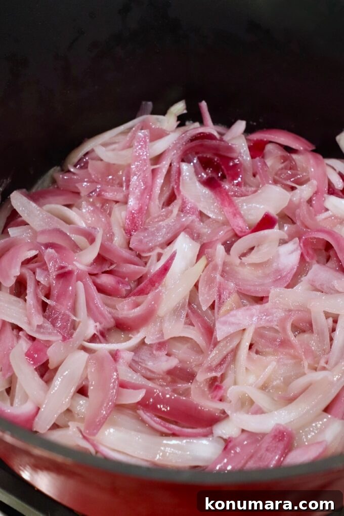 Caramelizing Onions: Step-by-Step Guide 10 sliced onions cooking in pot on stove