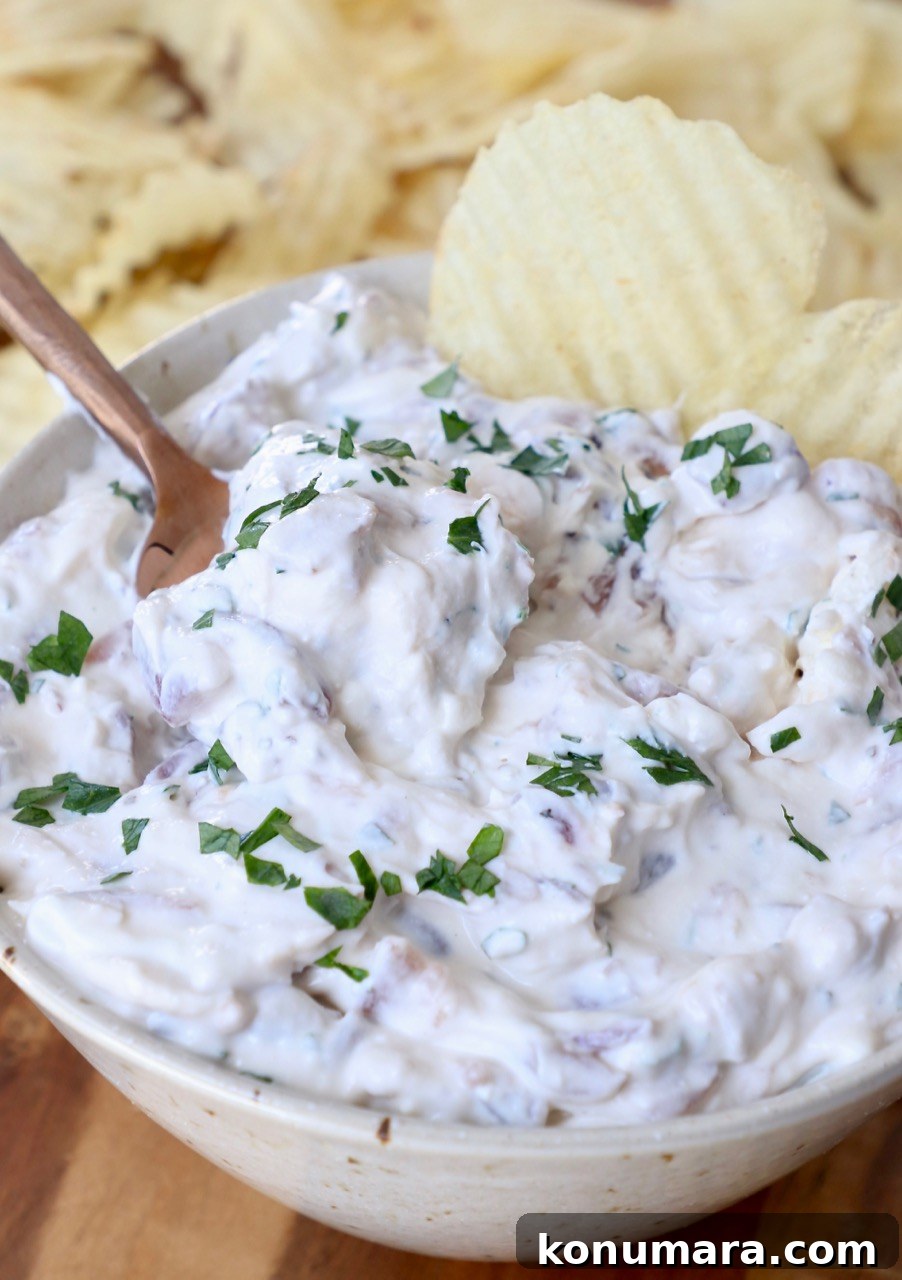french onion dip in bowl with wavy potato chips