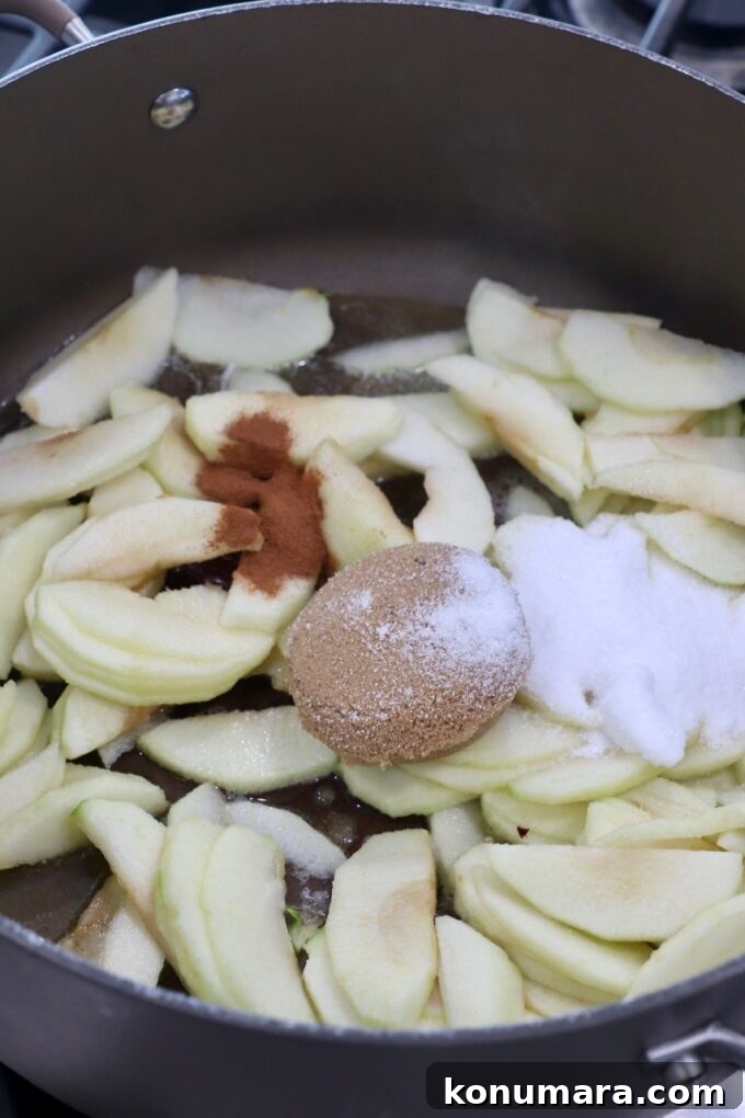 apples in pan with sugar and cinnamon