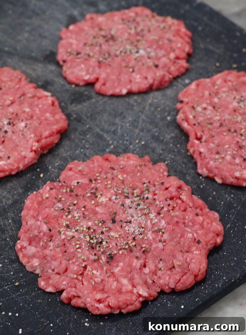 Animal-Style Burger Recipe: In-N-Out Copycat 4 seasoned hamburger patty on cutting board