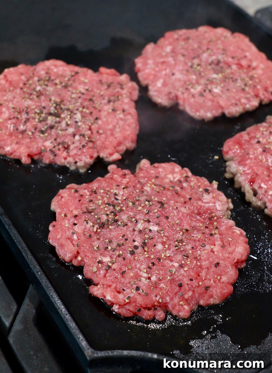 Animal-Style Burger Recipe: In-N-Out Copycat 5 seasoned burger patties on cast iron griddle