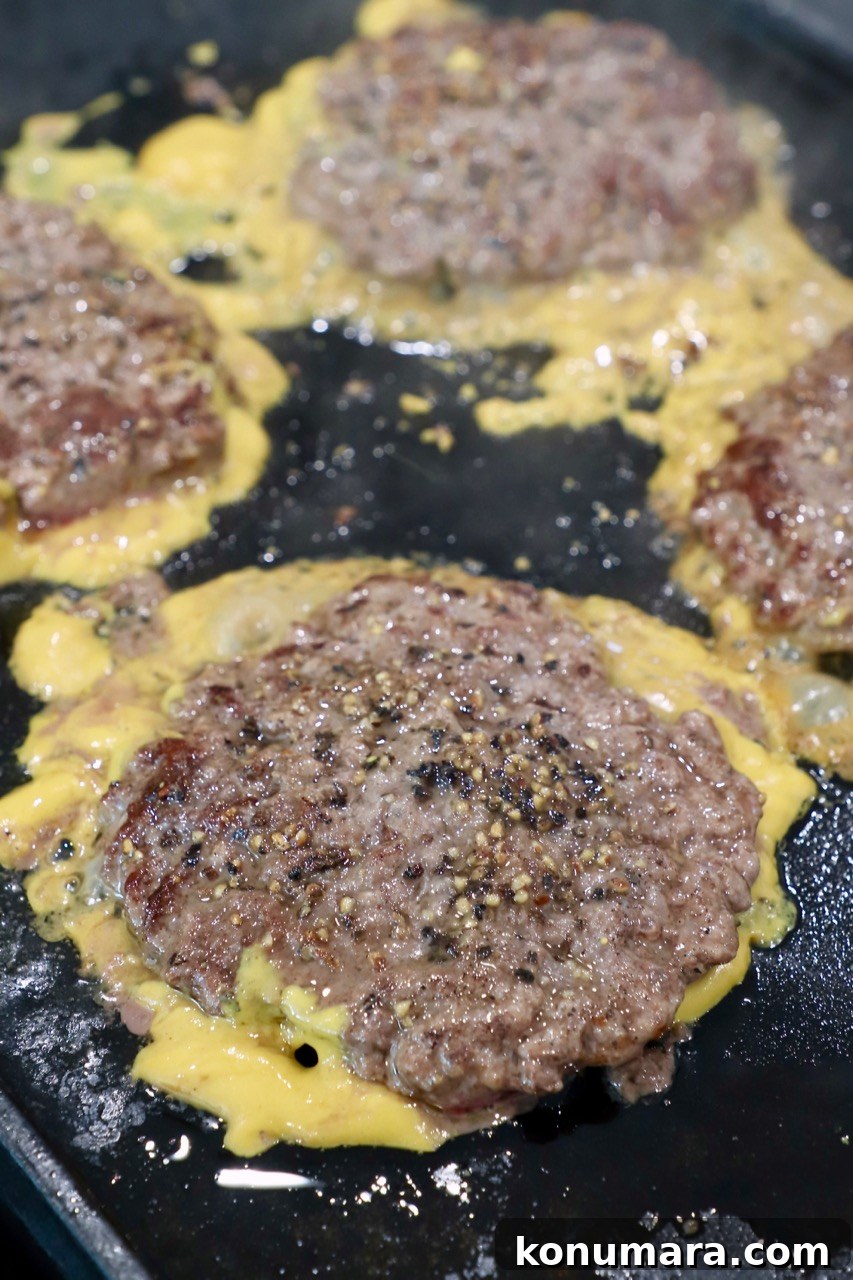 Animal-Style Burger Recipe: In-N-Out Copycat 7 cooked burger patties on griddle