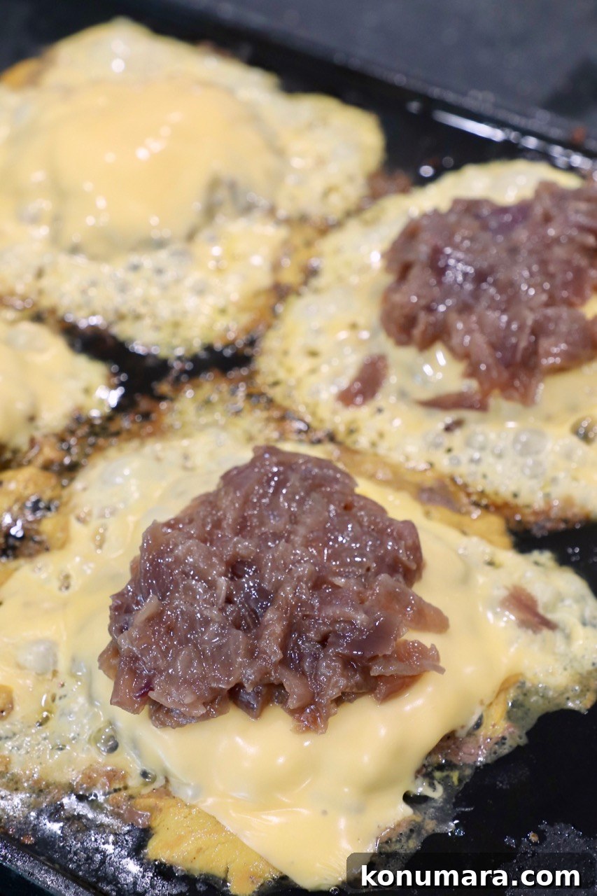 Animal-Style Burger Recipe: In-N-Out Copycat 9 caramelized onions on top of cheeseburger patties on griddle