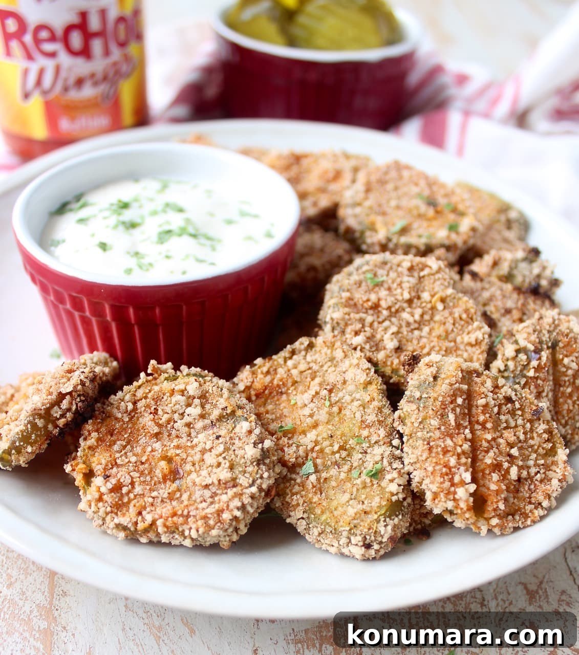 Pickle Chips are dipped in buffalo sauce, then rolled in a spicy Rice Chex mixture and baked golden brown for the perfect gluten-free & vegetarian snack!