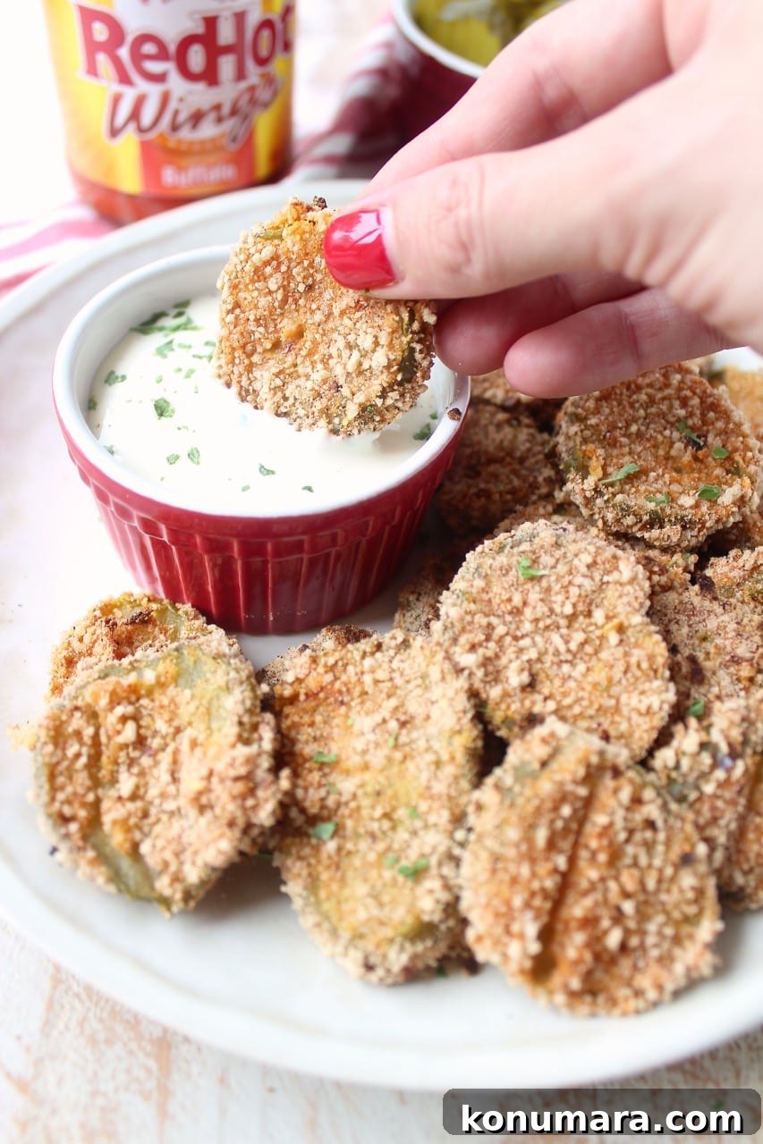 Pickle Chips are dipped in buffalo sauce, then rolled in a spicy Rice Chex mixture and baked golden brown for the perfect gluten-free & vegetarian snack!