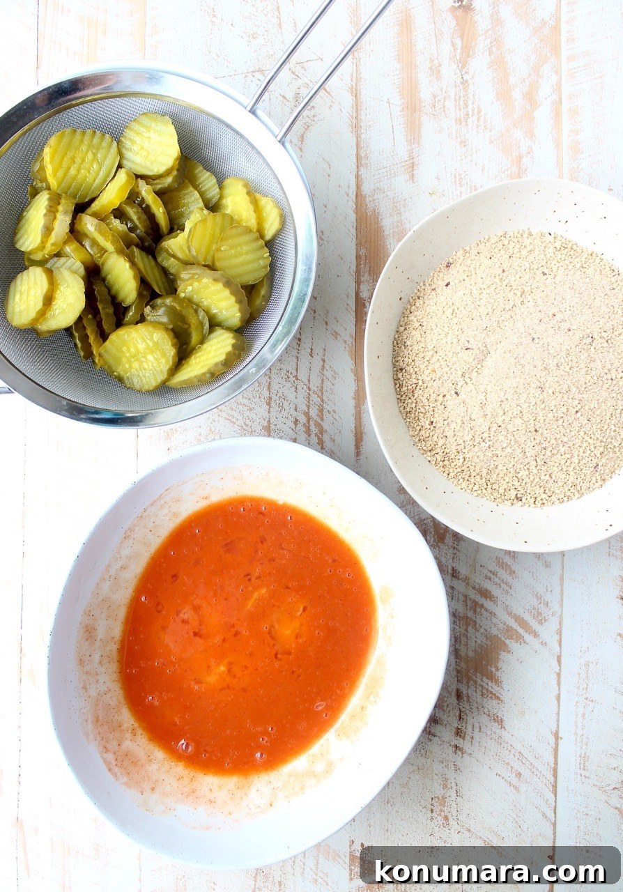 Pickle Chips are dipped in buffalo sauce, then rolled in a spicy Rice Chex mixture and baked golden brown for the perfect gluten-free & vegetarian snack!