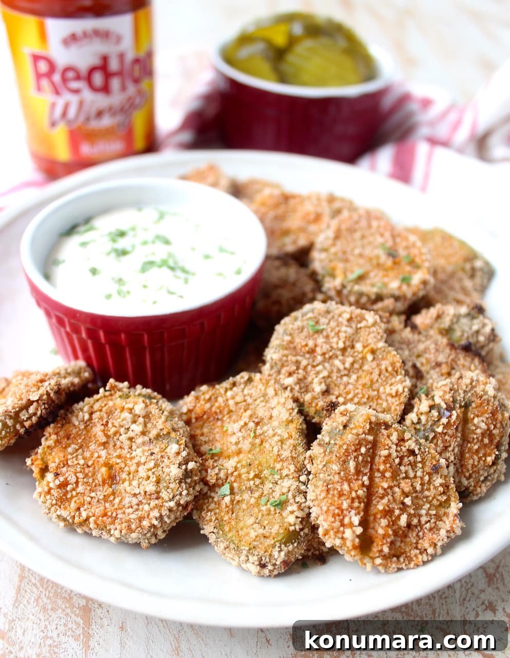 Pickle Chips are dipped in buffalo sauce, then rolled in a spicy Rice Chex mixture and baked golden brown for the perfect gluten-free & vegetarian snack!