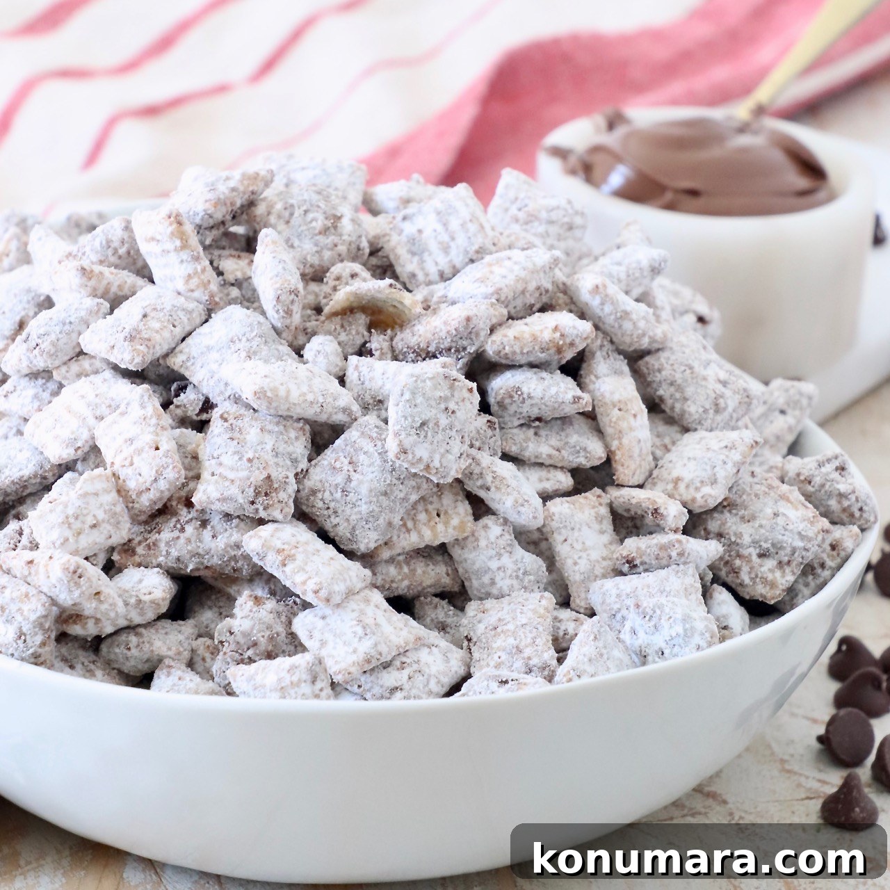 No-Bake Nutella Muddy Buddies Recipe 5 nutella muddy buddies in white bowl