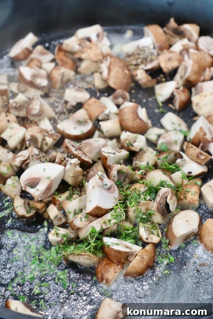 Velvety Cream of Mushroom Soup Recipe 4 diced mushrooms in skillet with fresh thyme