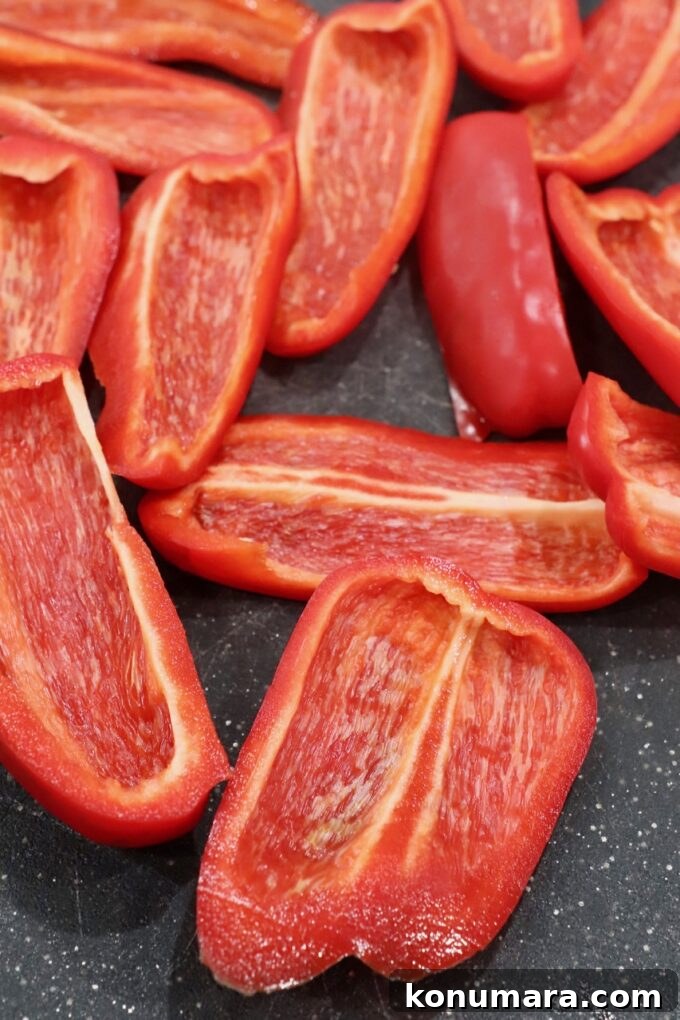 slices of red bell pepper on cutting board