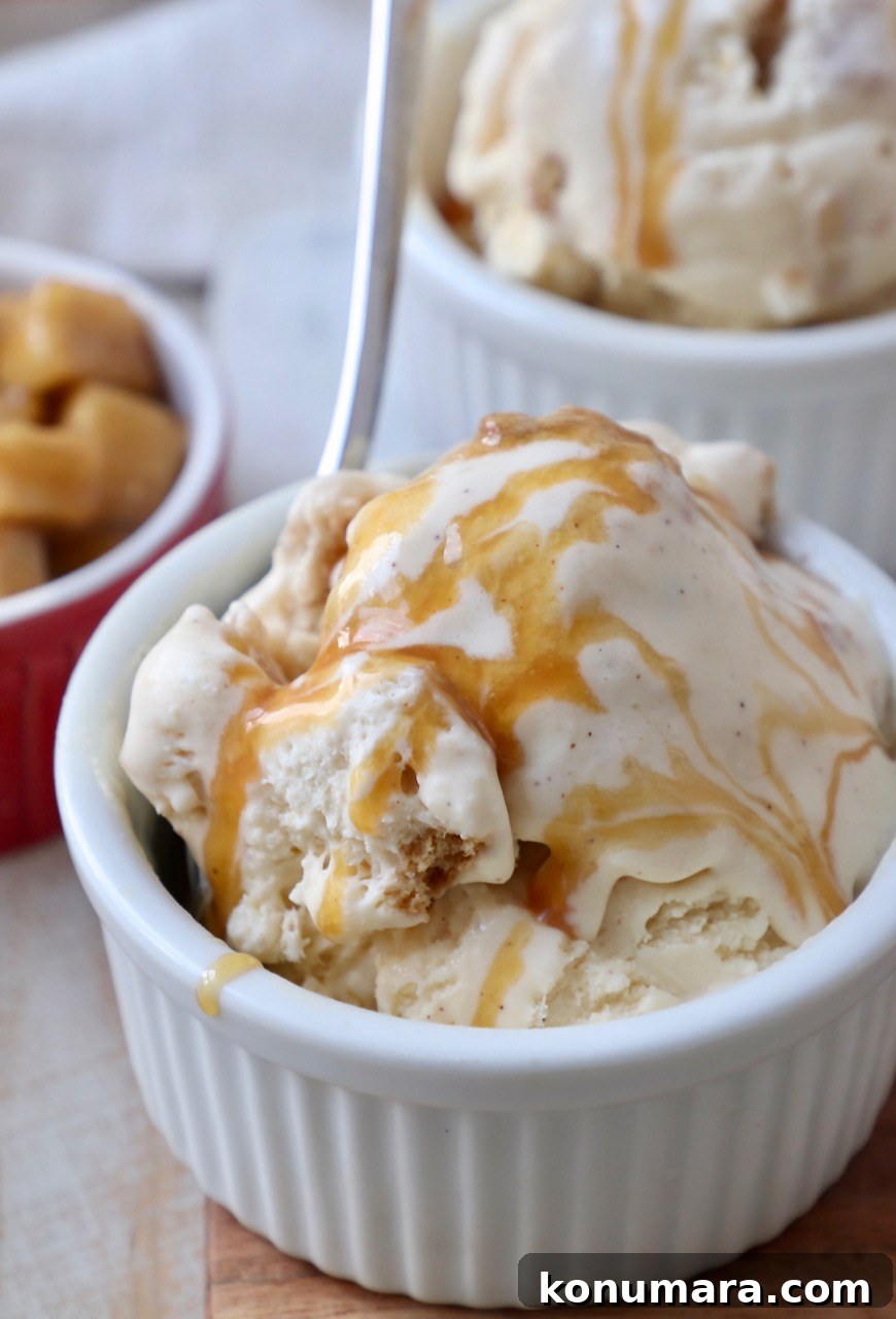ice cream in small white bowl drizzled with caramel syrup