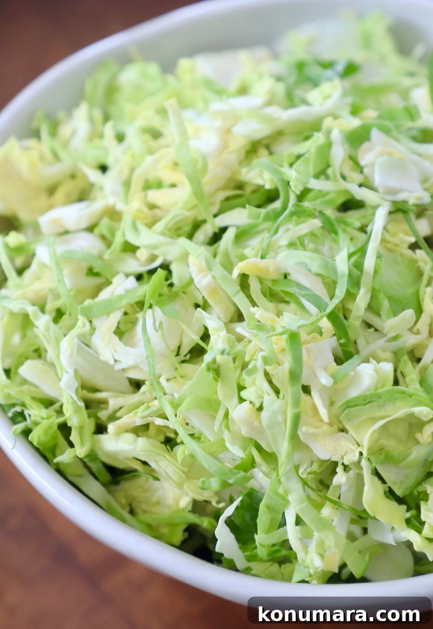 How to Shred Brussels Sprouts for Salads and Slaws 2 shredded brussel sprouts in white bowl