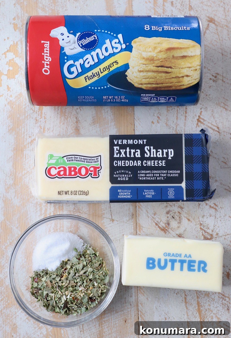 ingredients for cheesy pull apart rolls on wood board