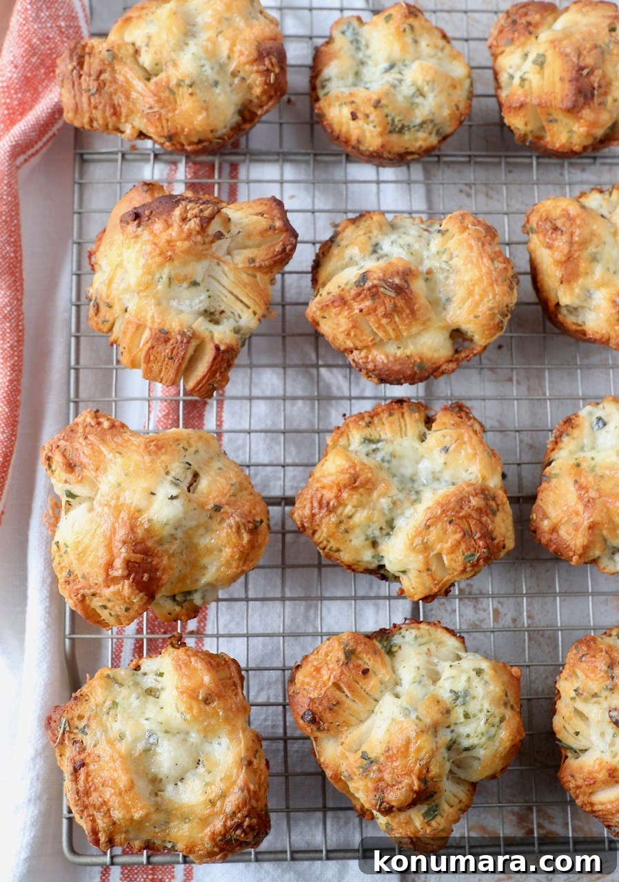 baked cheesy pull apart rolls on wire rack