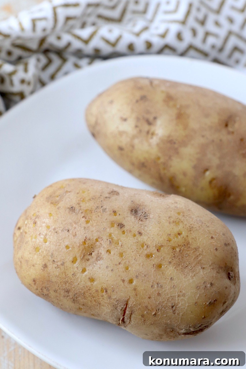 cooked russet potatoes on white plate