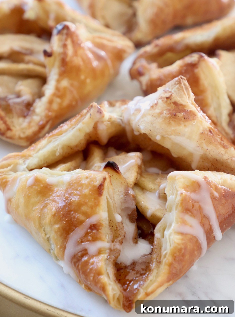 Classic Flaky Apple Danish with Cinnamon Filling 2 apple danish on marble serving tray