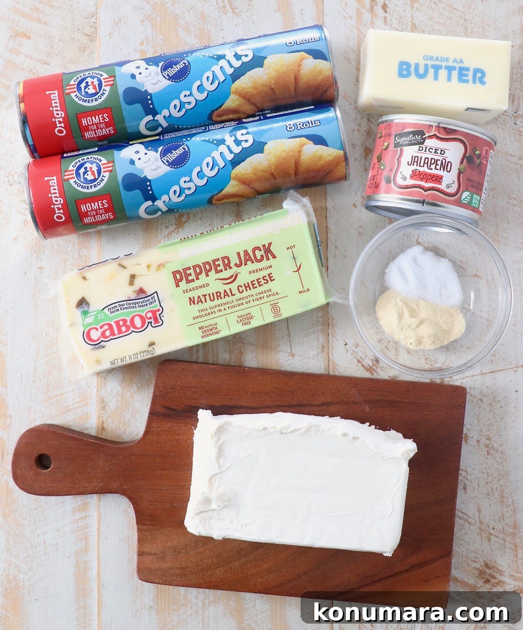 Cheesy Jalapeno Popper Crescent Rolls 3 jalapeno popper crescent rolls ingredients on white wood board