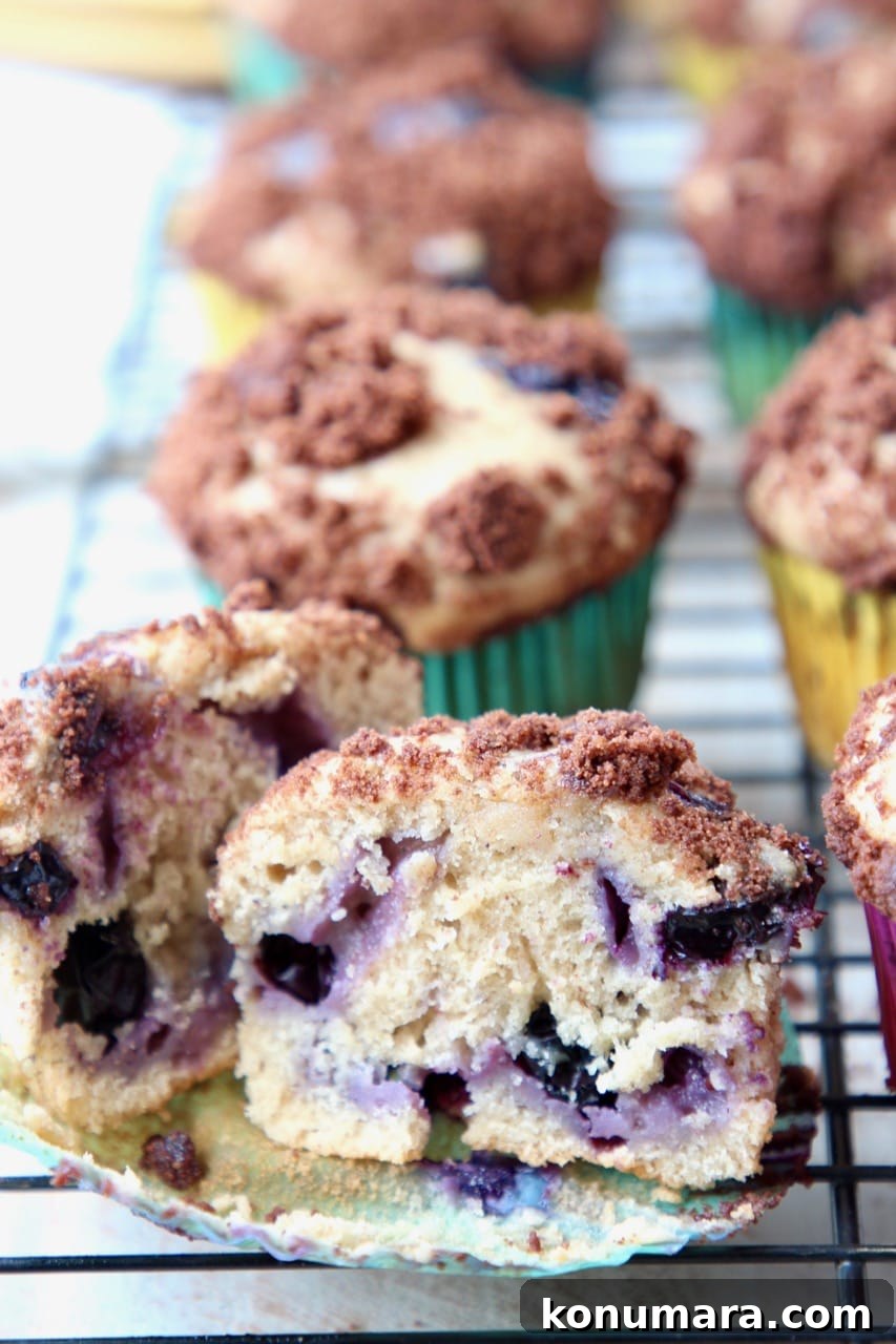 Decadent Blueberry Cream Cheese Muffins with Chocolate Crumble 3 Blueberry Cream Cheese Muffins with Chocolate Crumble Cut in Half
