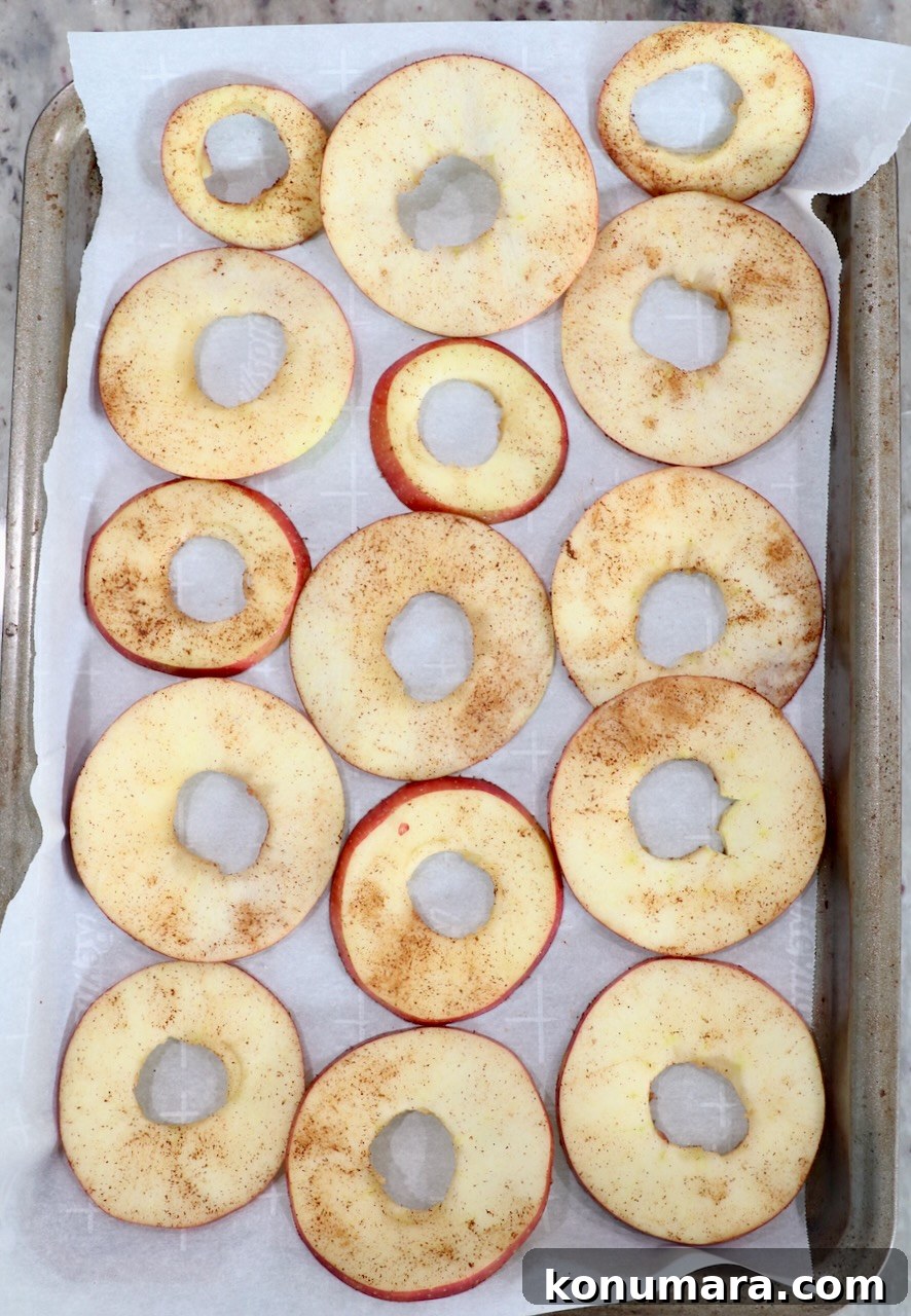 apple slices on parchment lined baking sheet