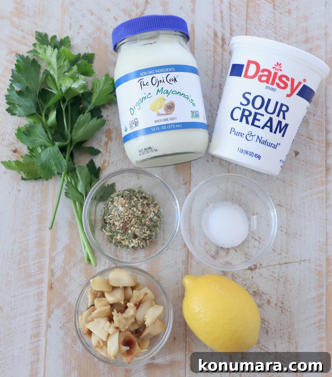 Creamy Roasted Garlic Dip Recipe 3 roasted garlic dip ingredients on white wood board