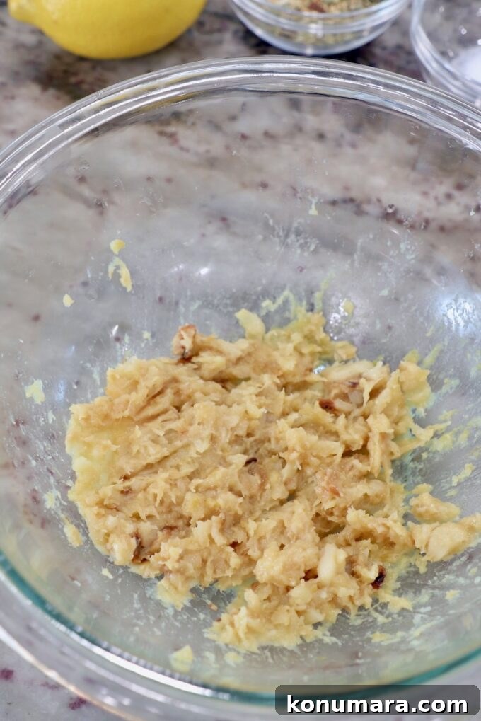 Creamy Roasted Garlic Dip Recipe 5 smashed garlic in glass bowl