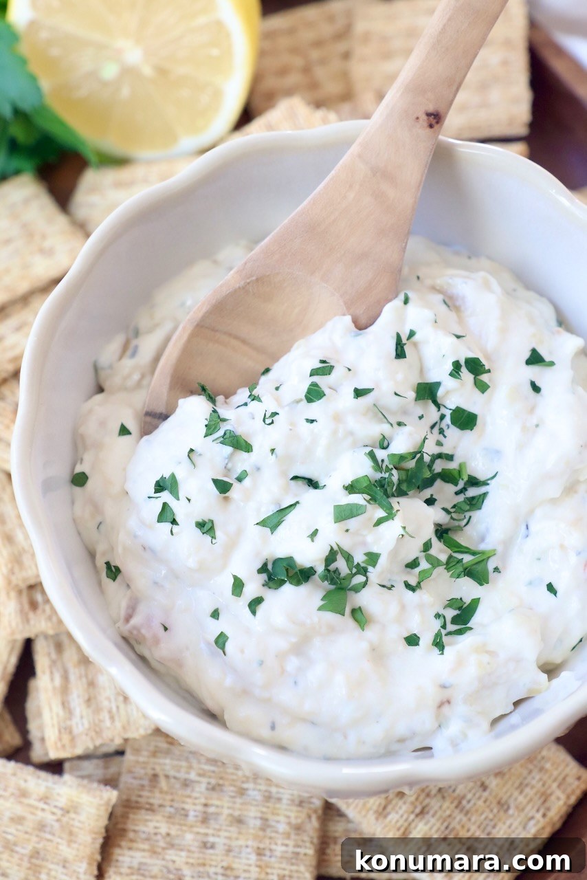 Creamy Roasted Garlic Dip Recipe 8 garlic dip in bowl topped with fresh chopped parsley