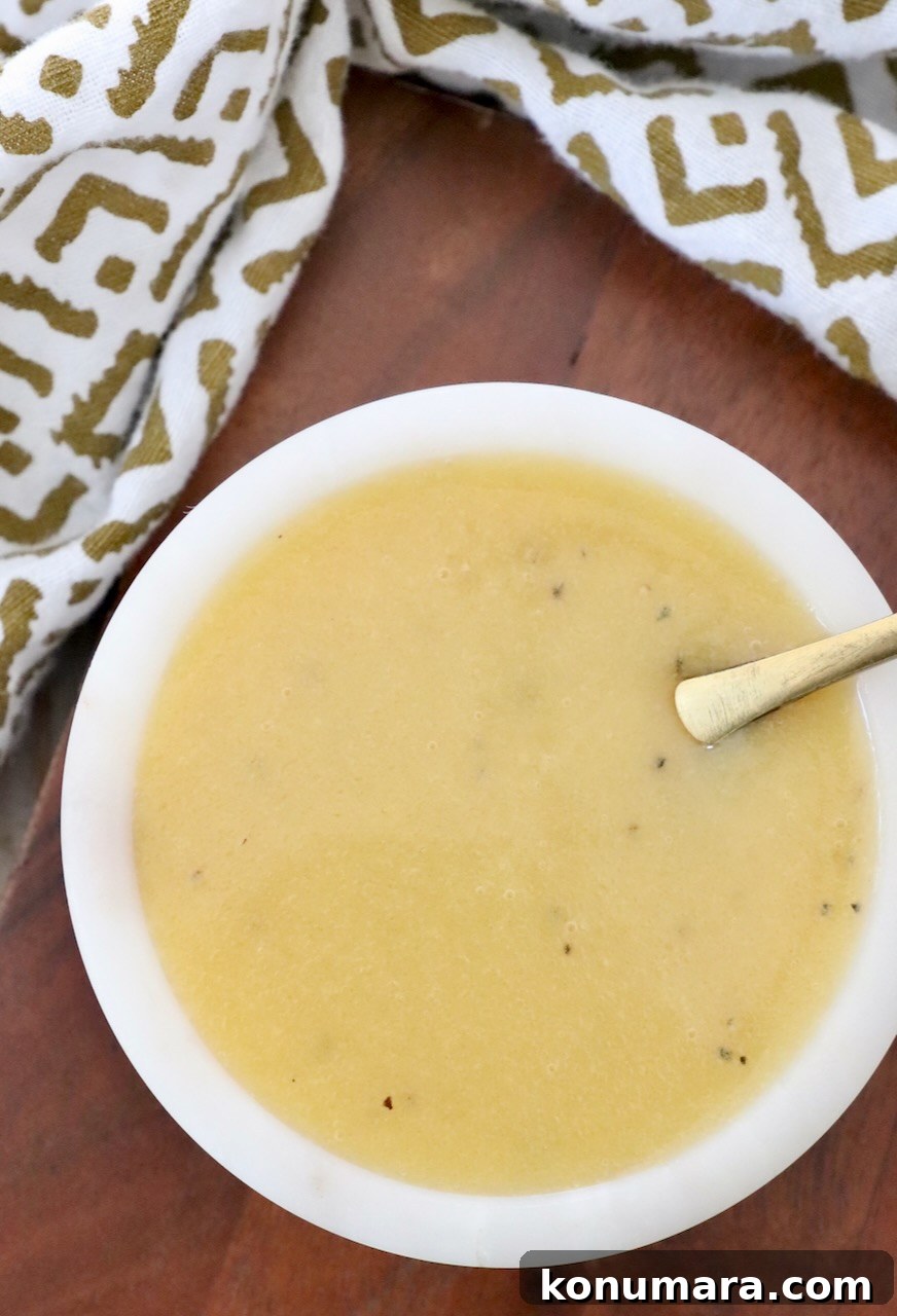 honey mustard dressing in small bowl with spoon