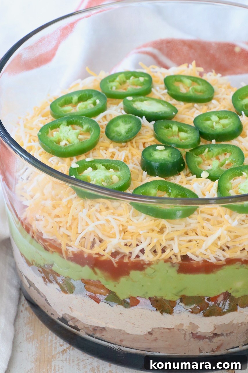 seven layer dip in glass trifle bowl