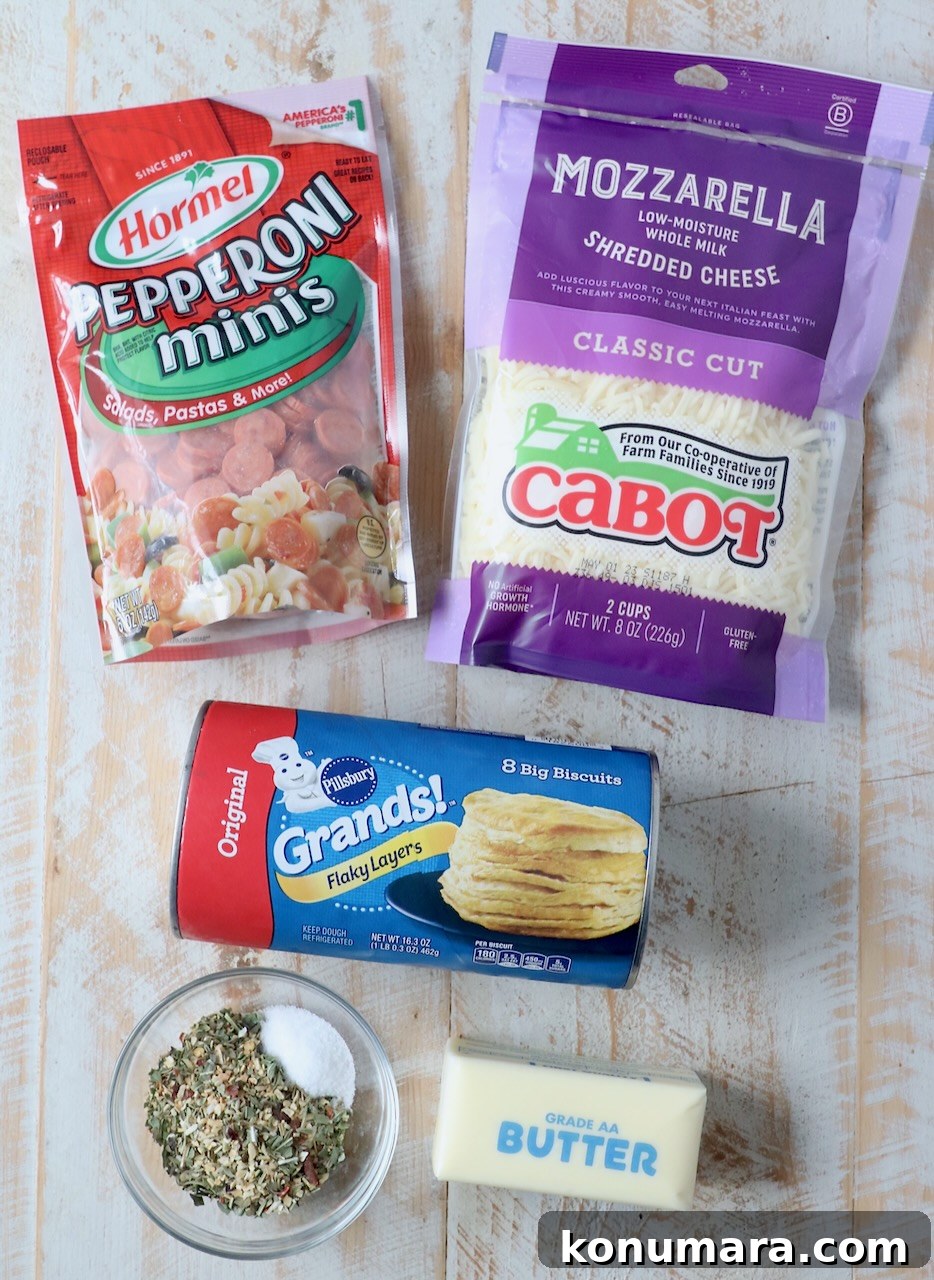 ingredients for pizza rolls on wood board