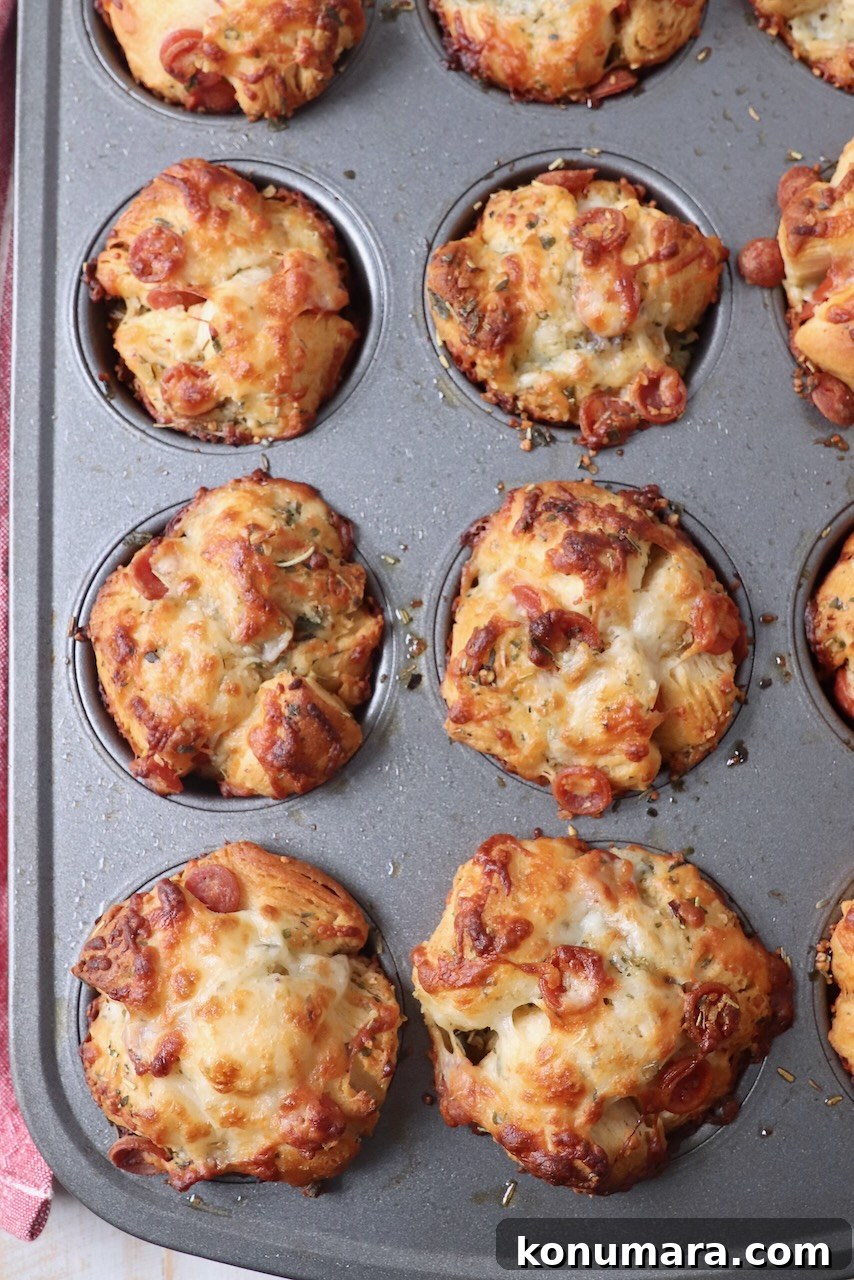 baked pizza rolls in muffin tin