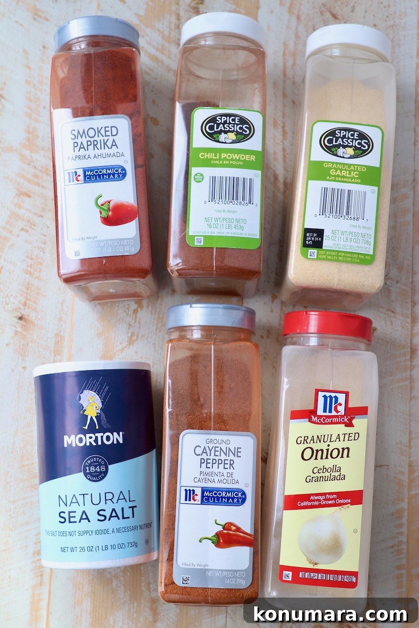 Chicken Wing Seasoning Recipe for Crispy, Flavorful Wings 5 chicken wing seasoning ingredients on white wood board