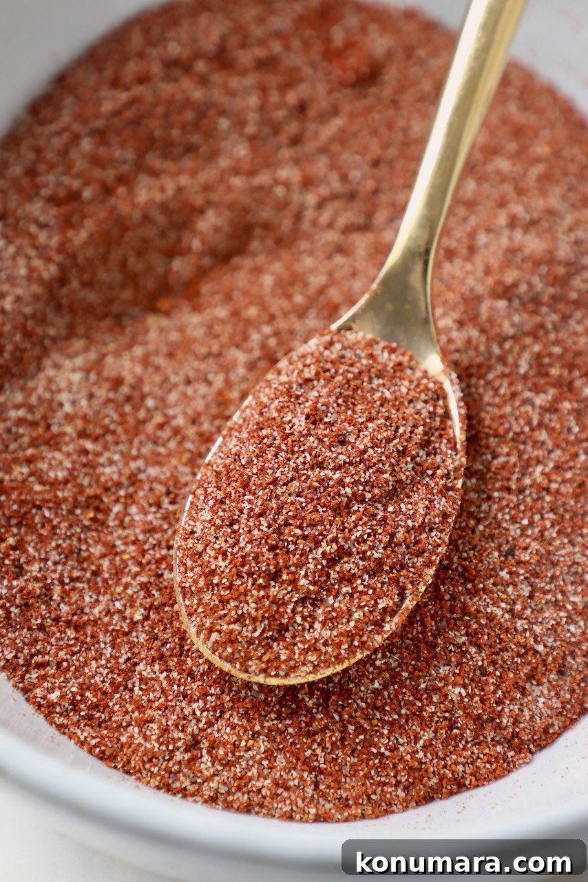 Chicken Wing Seasoning Recipe for Crispy, Flavorful Wings 7 chicken wing dry rub in bowl with gold spoon