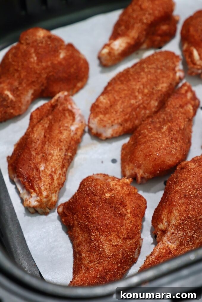 Crispy Air Fryer Chicken Wings Recipe 6 seasoned chicken wings in air fryer basket