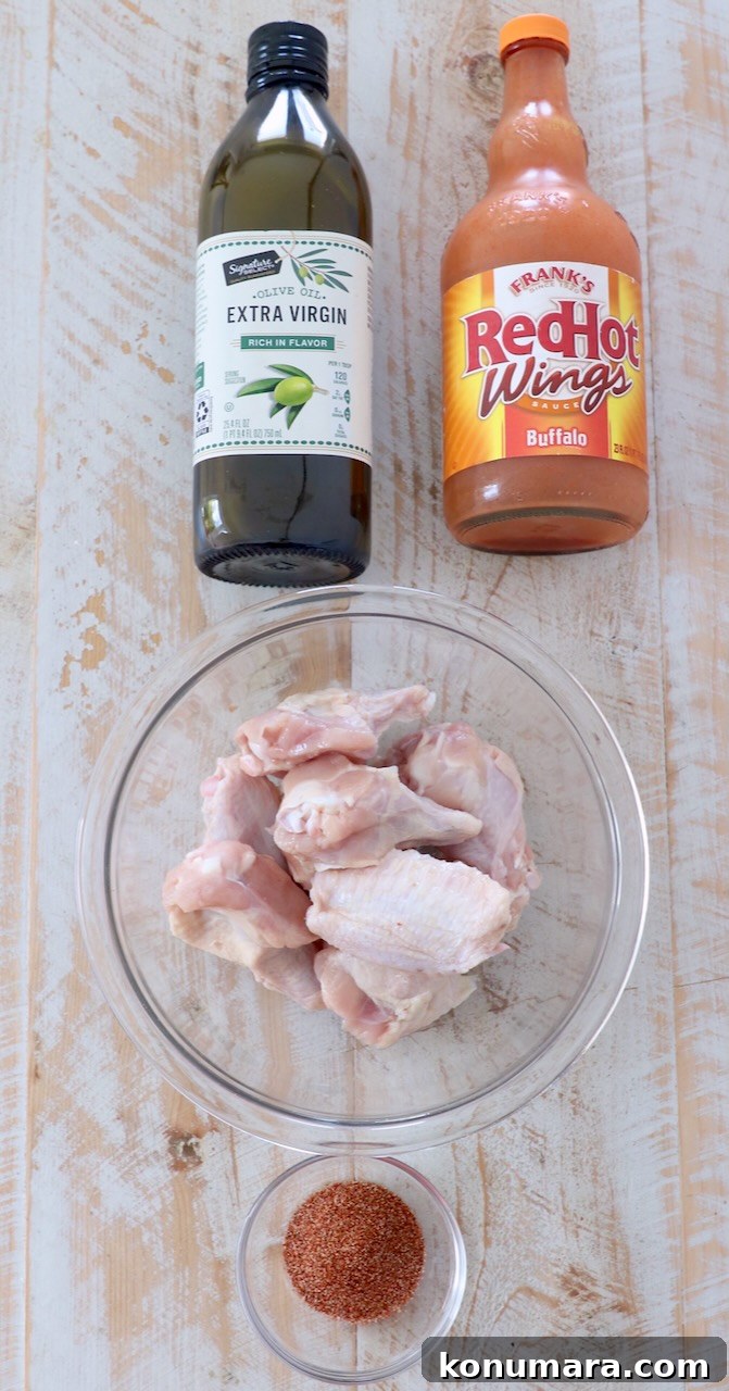 ingredients for buffalo chicken wings on wood board