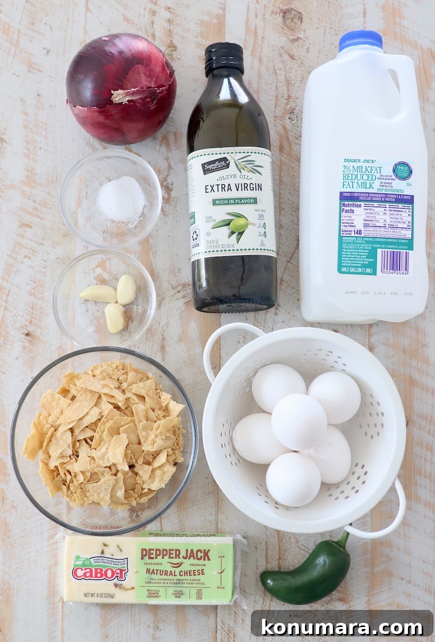 Classic Spanish Migas Recipe with Chorizo and Fried Eggs 3 ingredients for migas on white wood cutting board