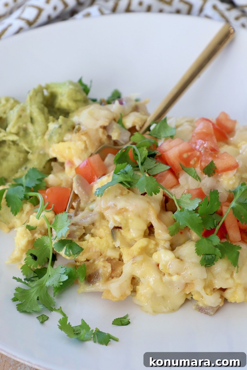 Classic Spanish Migas Recipe with Chorizo and Fried Eggs 9 migas on plate with gold fork