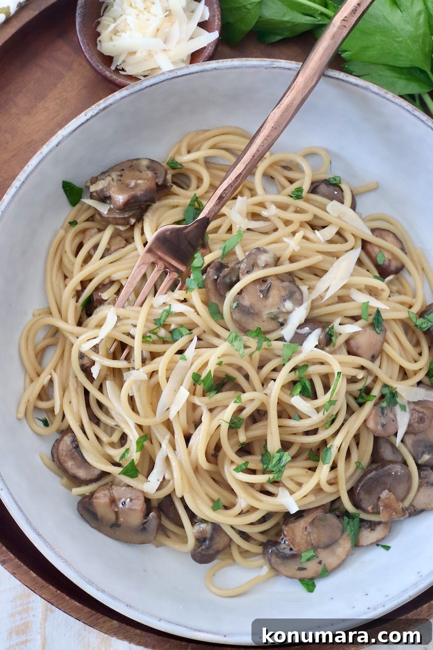 Creamy Garlic Mushroom Pasta Recipe with Parmesan 9 mushroom pasta in bowl with fork