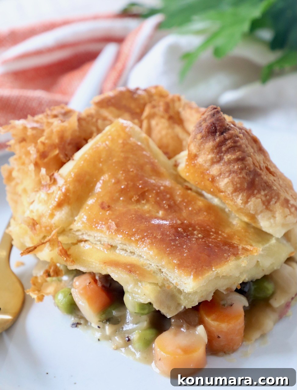 piece of vegetable pot pie on plate with fork
