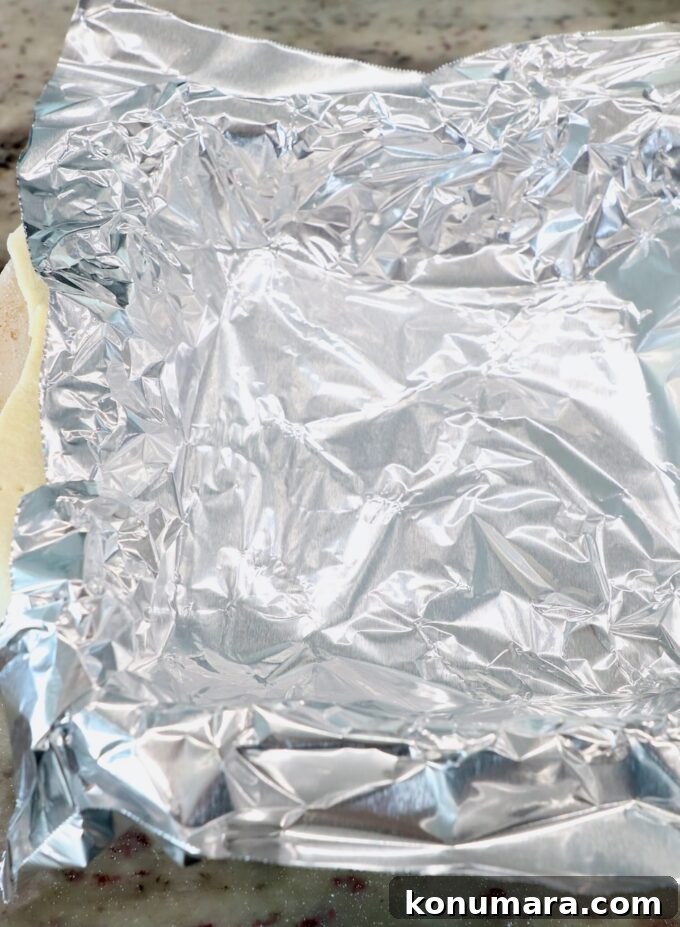piece of foil in square baking dish