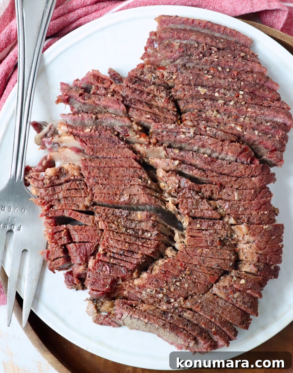 How to Smoke a Chuck Roast for Tender, Juicy Results 2 sliced smoked chuck roast on plate with serving fork