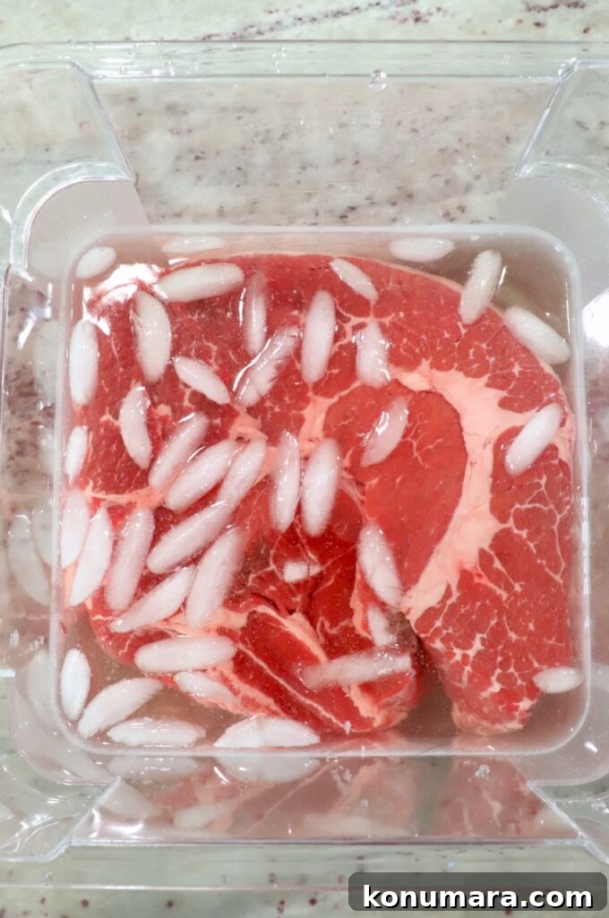 How to Smoke a Chuck Roast for Tender, Juicy Results 3 chuck roast in brine with ice cubes in plastic tub