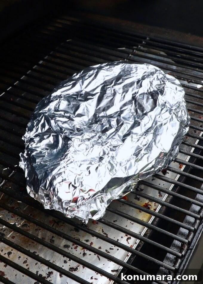 How to Smoke a Chuck Roast for Tender, Juicy Results 7 chuck roast wrapped in foil on smoker