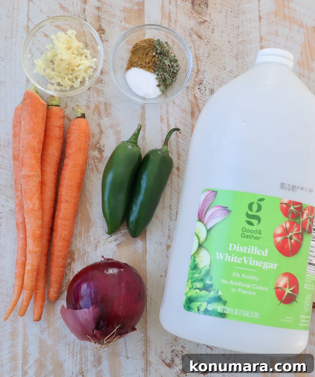 ingredients for mexican pickled vegetables on white wood board
