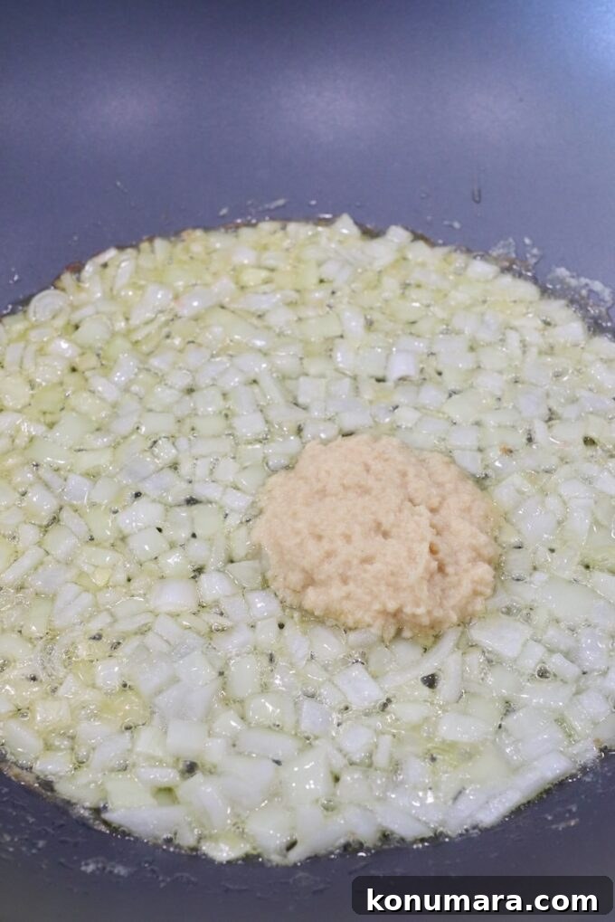Paneer Makhani: Creamy Indian Butter Paneer Recipe 4 diced onions in large skillet with garlic ginger paste